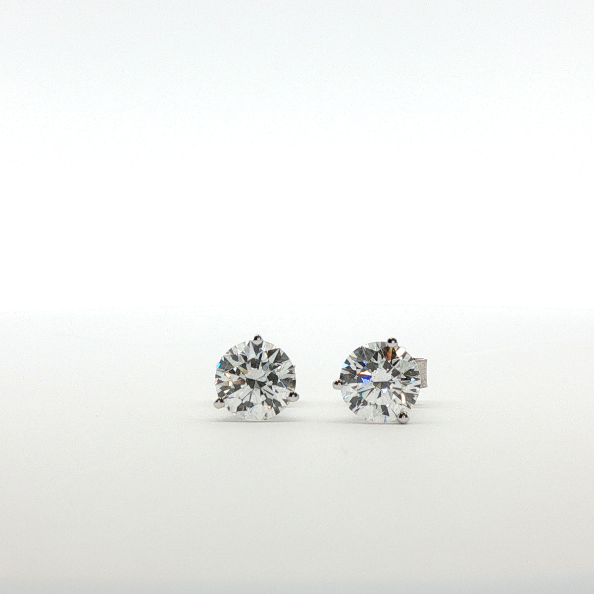 Round Diamond Earrings in 3 prong Martini Setting